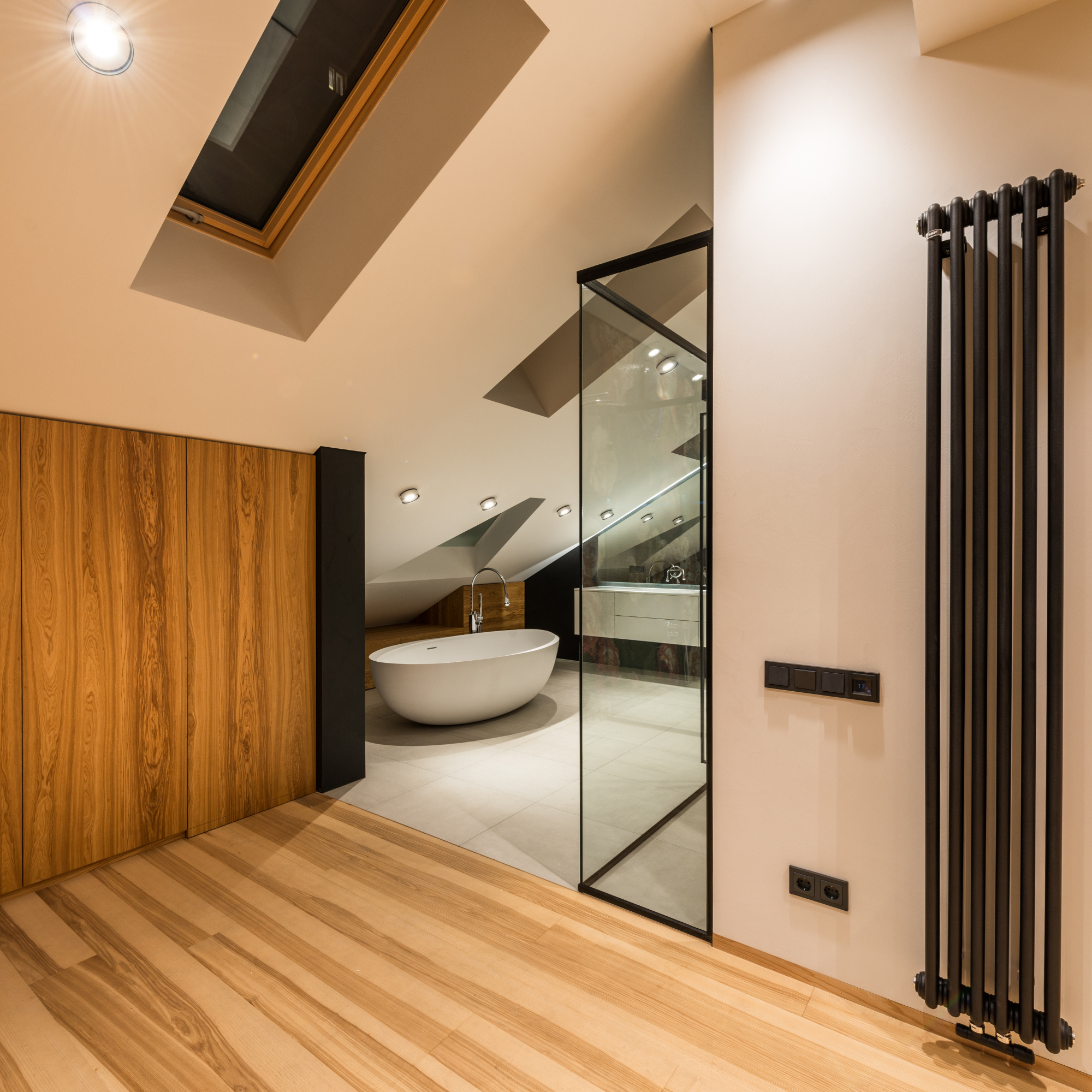 Modern bathroom remodel featuring custom tile shower, frameless glass enclosure, and stone countertops in Chandler, AZ